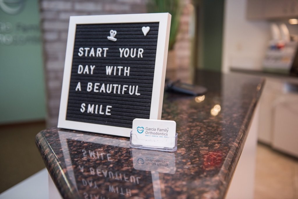 Cute sign with the quote Start your day with a beautiful smile
